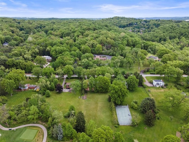 drone / aerial view of a heavily wooded area