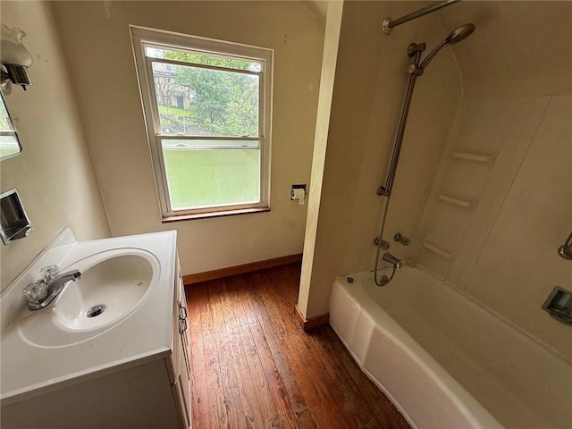 2895 Hemlock St, Bethel Park, PA 15102 - full bathroom featuring hardwood / wood-style flooring, baseboards, vanity, and tub / shower combination