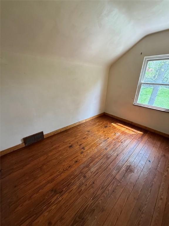 2895 Hemlock St, Bethel Park, PA 15102 - bonus room featuring lofted ceiling, wood-type flooring, and baseboards