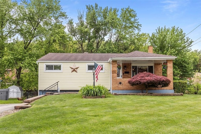 187 Anderson Rd, North Huntingdon, PA 15642 - view of front facade with a chimney and brick siding