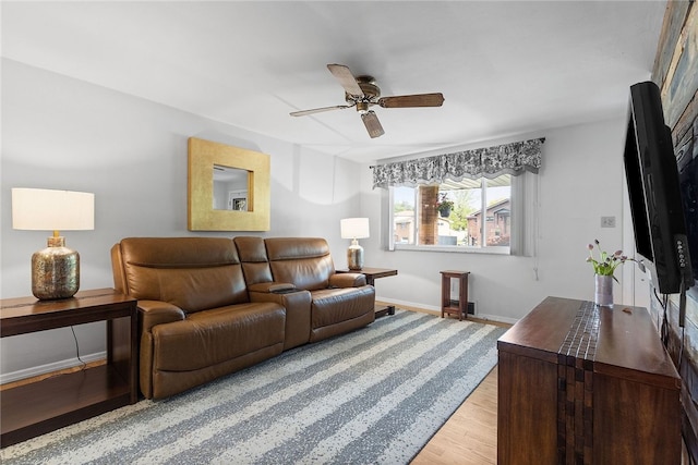 187 Anderson Rd, North Huntingdon, PA 15642 - living room featuring a ceiling fan, light wood-type flooring, and baseboards