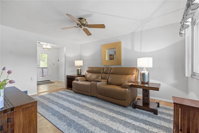 187 Anderson Rd, North Huntingdon, PA 15642 - living room featuring a ceiling fan, light wood-type flooring, and baseboards