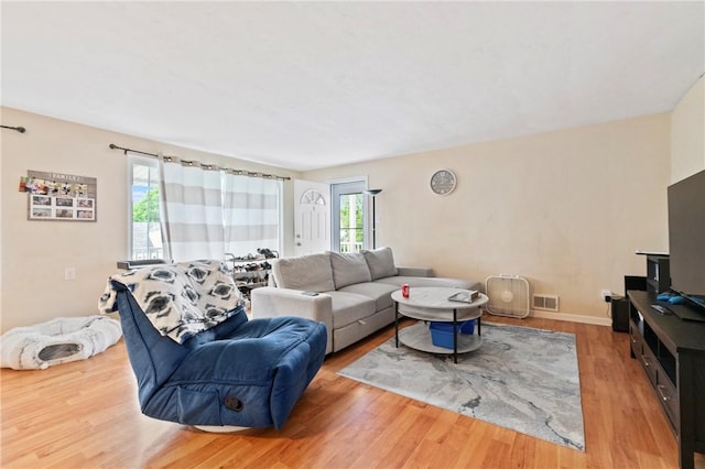 living room with wood finished floors