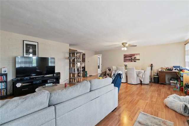 living room featuring wood finished floors and ceiling fan