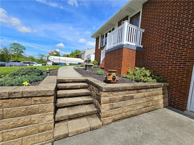 view of side of home featuring brick siding