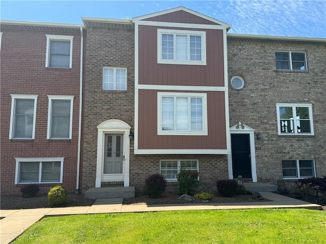 109 Canterbury Commons Unit 109, White Twp Ind, PA 15701 - view of front of home featuring brick siding and a front yard