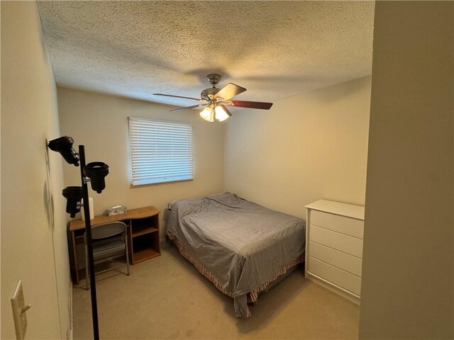 109 Canterbury Commons Unit 109, White Twp Ind, PA 15701 - bedroom featuring light carpet, a textured ceiling, and ceiling fan