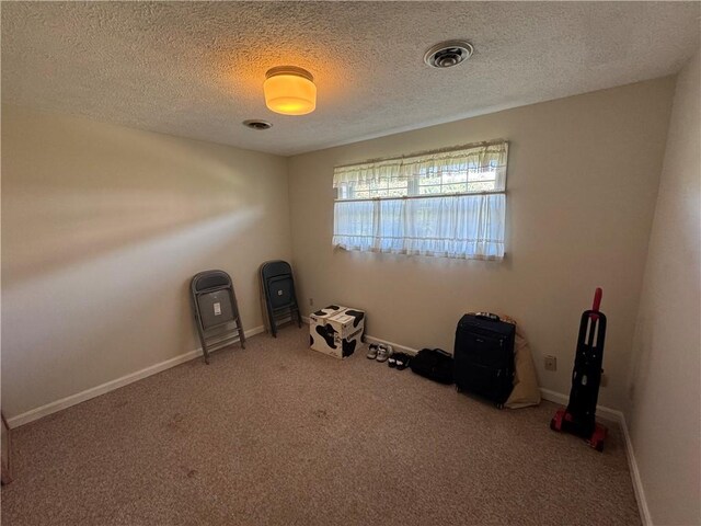 109 Canterbury Commons Unit 109, White Twp Ind, PA 15701 - miscellaneous room with carpet floors, a textured ceiling, and baseboards