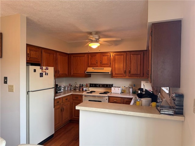109 Canterbury Commons Unit 109, White Twp Ind, PA 15701 - kitchen with white appliances, exhaust hood, light countertops, a peninsula, and ceiling fan