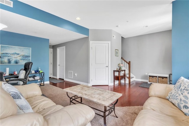 living area featuring stairway, wood finished floors, baseboards, and recessed lighting