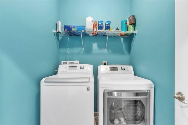 clothes washing area with independent washer and dryer