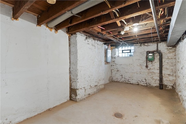 basement with gas meter and electric panel