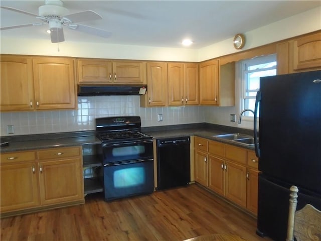 1040 Catherine Dr, Conway, PA 15027 - kitchen with black appliances, under cabinet range hood, a sink, and dark wood finished floors