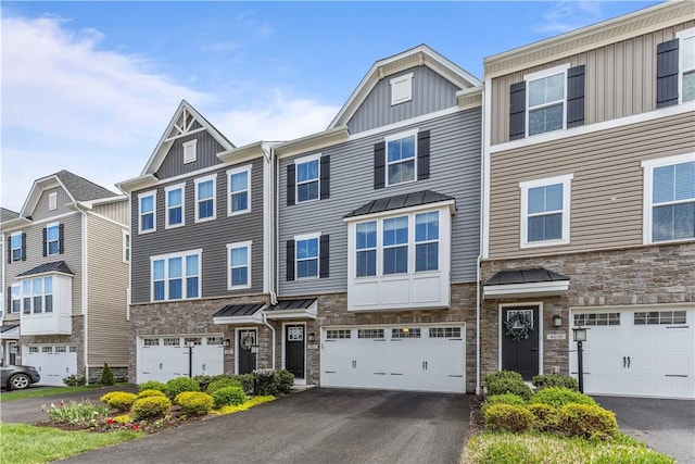4012 Crown Dr, South Park, PA 15129 - view of property featuring stone siding, board and batten siding, driveway, and a garage