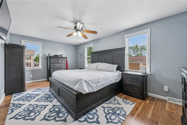 2939 Main St, Beallsville, PA 15313 - bedroom featuring baseboards, light wood-style flooring, and a ceiling fan