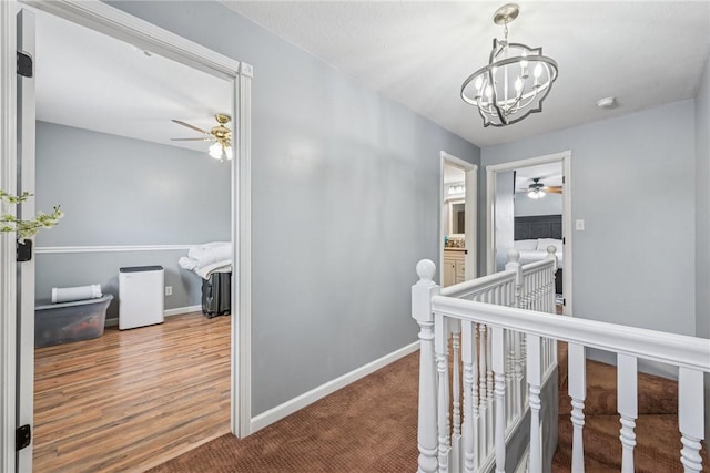 2939 Main St, Beallsville, PA 15313 - hall featuring an upstairs landing, a chandelier, baseboards, and carpet