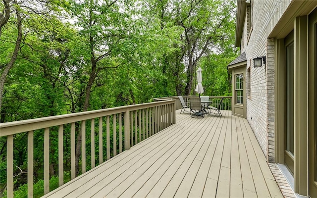 wooden deck with outdoor dining area
