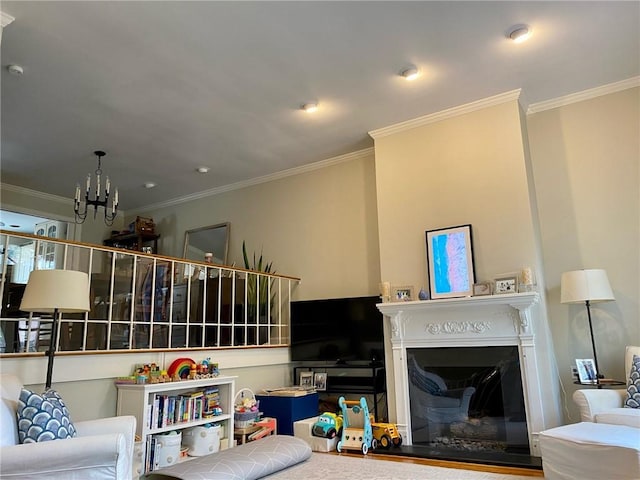 living area featuring a fireplace, a chandelier, and ornamental molding