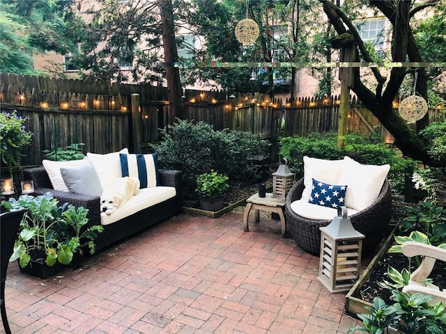 view of patio featuring outdoor lounge area and a fenced backyard