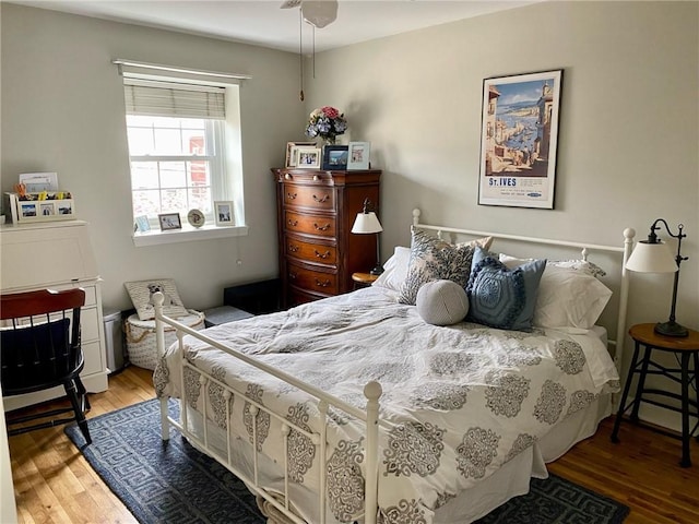 bedroom featuring wood finished floors