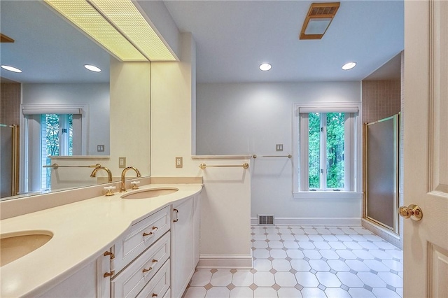 full bathroom featuring healthy amount of natural light, a stall shower, and recessed lighting