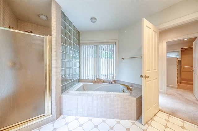 full bath with a shower stall and a garden tub