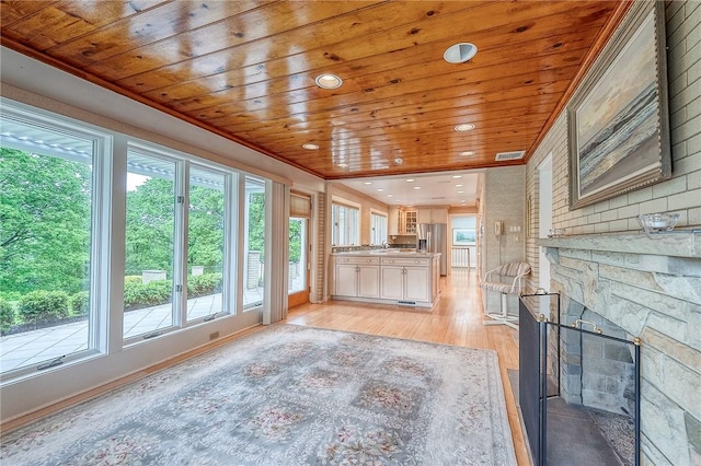 unfurnished living room featuring wooden ceiling, light wood-style floors, and recessed lighting