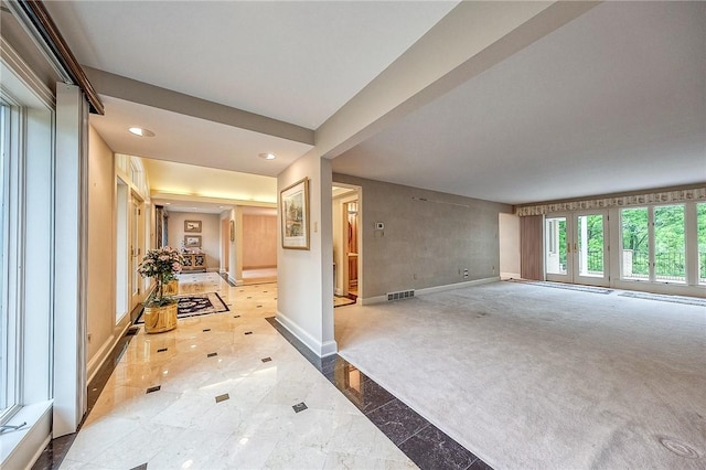 interior space with baseboards, recessed lighting, and carpet