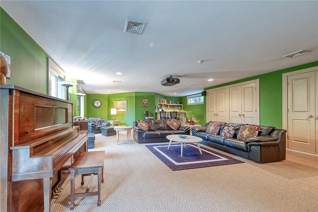 living area featuring carpet, recessed lighting, and plenty of natural light