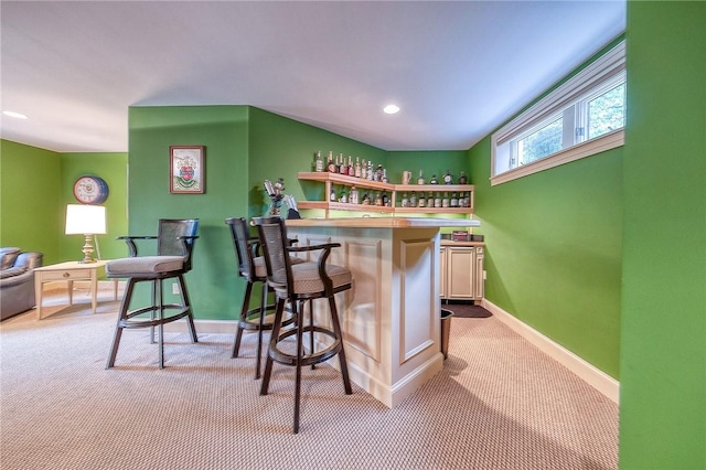indoor dry bar featuring carpet flooring, baseboards, and recessed lighting