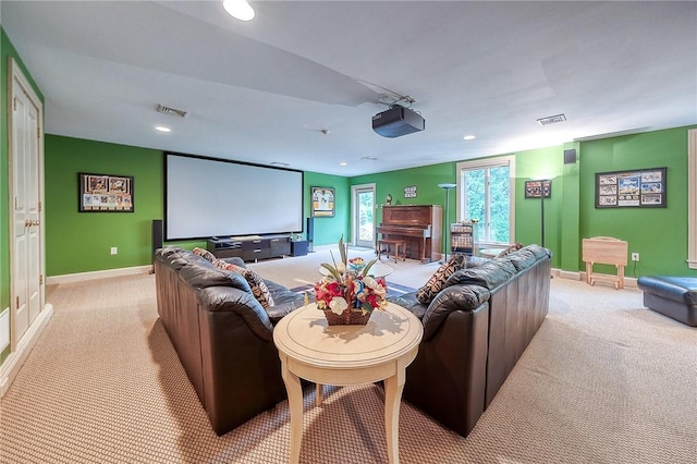 cinema room with light colored carpet, baseboards, and recessed lighting
