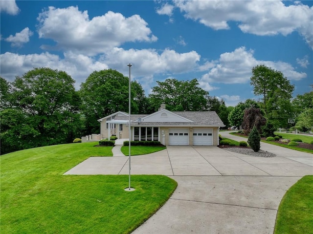 view of front of house featuring driveway, an attached garage, a front lawn, a chimney, and view of scattered trees