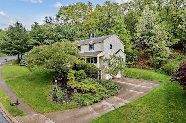 2622 Timberglen Dr, Franklin Park, PA 15090 - view of front of property with concrete driveway, an attached garage, a front yard, and a chimney