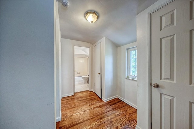 1593 Riverside Dr, Penn Hills, PA 15147 - hallway featuring wood finished floors, baseboards, and vaulted ceiling