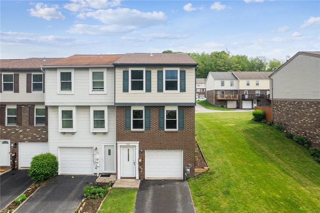 330 Shady Ridge Dr, Monroeville, PA 15146 - view of property with driveway, an attached garage, a front lawn, brick siding, and a residential view