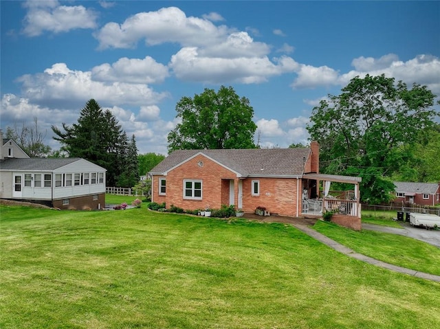 1814 Roosevelt Rd, Ohio Twp, PA 15143 - ranch-style house with a chimney, a front yard, and brick siding