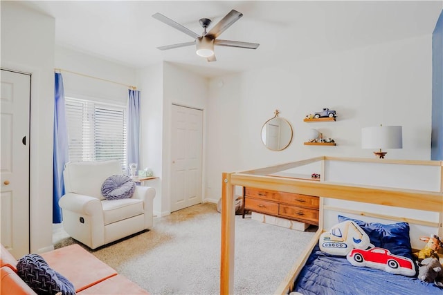 carpeted bedroom featuring a ceiling fan