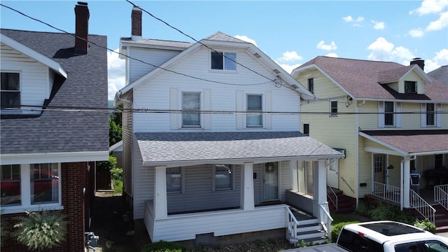 view of front of home featuring a porch and roof with shingles