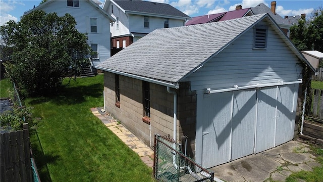view of home's exterior with roof with shingles