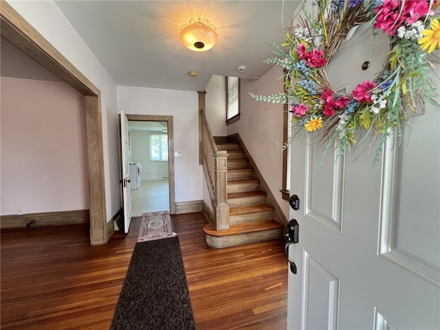 entrance foyer with wood finished floors, stairs, and baseboards