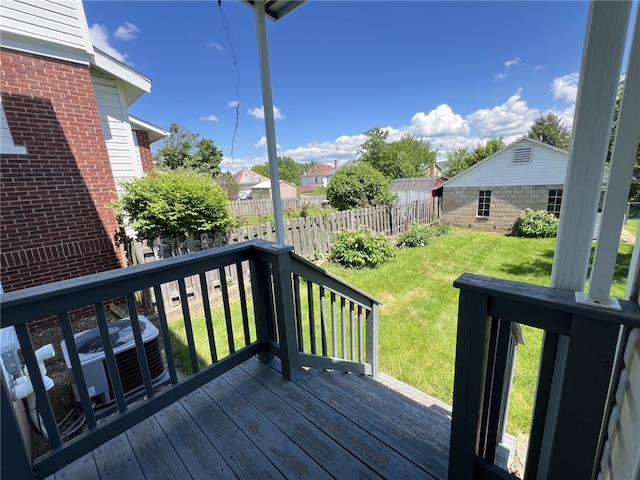 wooden deck featuring central AC unit