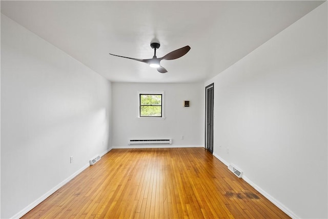 2710 Douglas Run Rd, Elizabeth Twp/Boro, PA 15037 - spare room with a baseboard radiator, a ceiling fan, light wood-style flooring, and baseboards