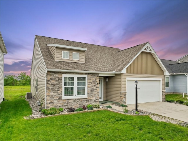 1024 Colonial Dr, Menallen Twp, PA 15401 - craftsman-style house featuring stone siding, a garage, and a yard