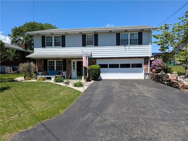 view of front of property featuring covered porch, driveway, a garage, a front lawn, and brick siding