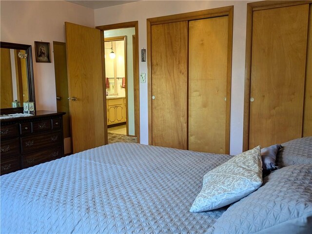 bedroom with multiple closets