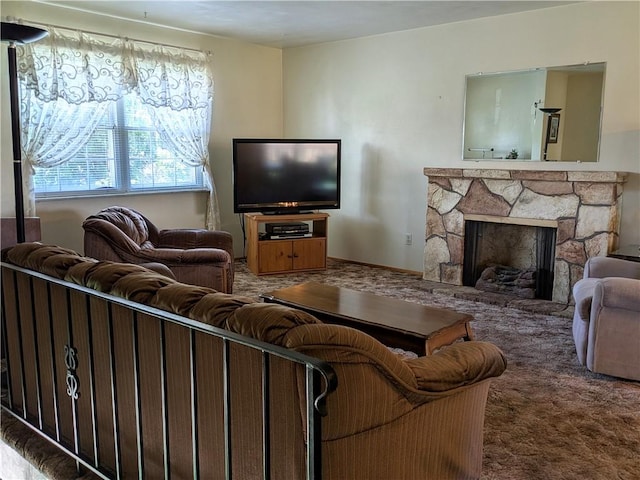 living room featuring carpet flooring and a stone fireplace