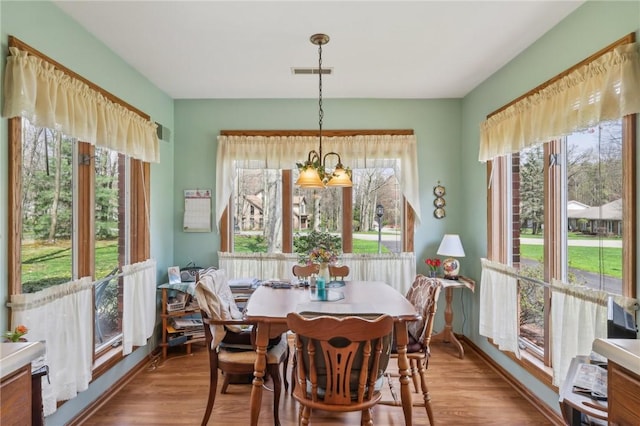 dining space featuring wood finished floors