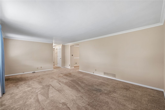 carpeted empty room featuring ornamental molding and baseboards