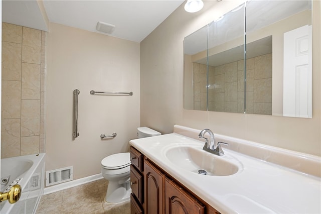bathroom with toilet, a bath, vanity, baseboards, and tile patterned floors