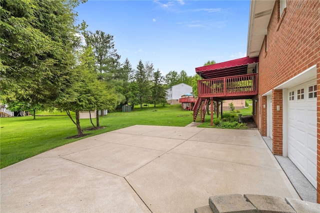 view of patio / terrace featuring a deck, a garage, and stairway